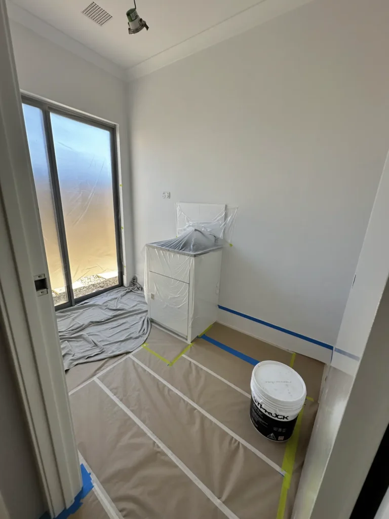 Professional airless spray painting of a residential exterior in Perth.