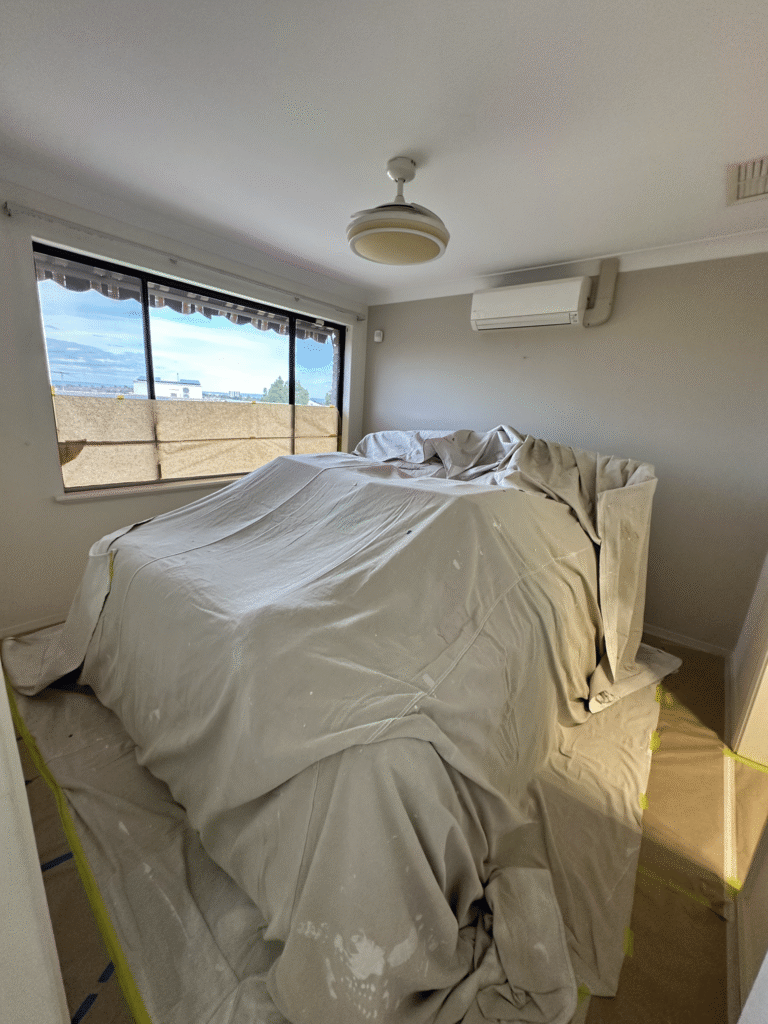 Specialized interior painting Perth featuring a custom feature wall and smooth finish.